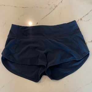 Lululemon size 4, 2.5 inch low rise speed up shorts, navy blue